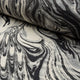 Black and cream marbled abstract linen fabric by the yard, rolled bolt view