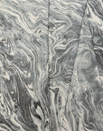 Gray and silver marbled abstract linen fabric by the yard, folded showing drape and weight