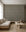 White hand-drawn grid on gray-blue commercial wallcovering installed in a minimalist living room